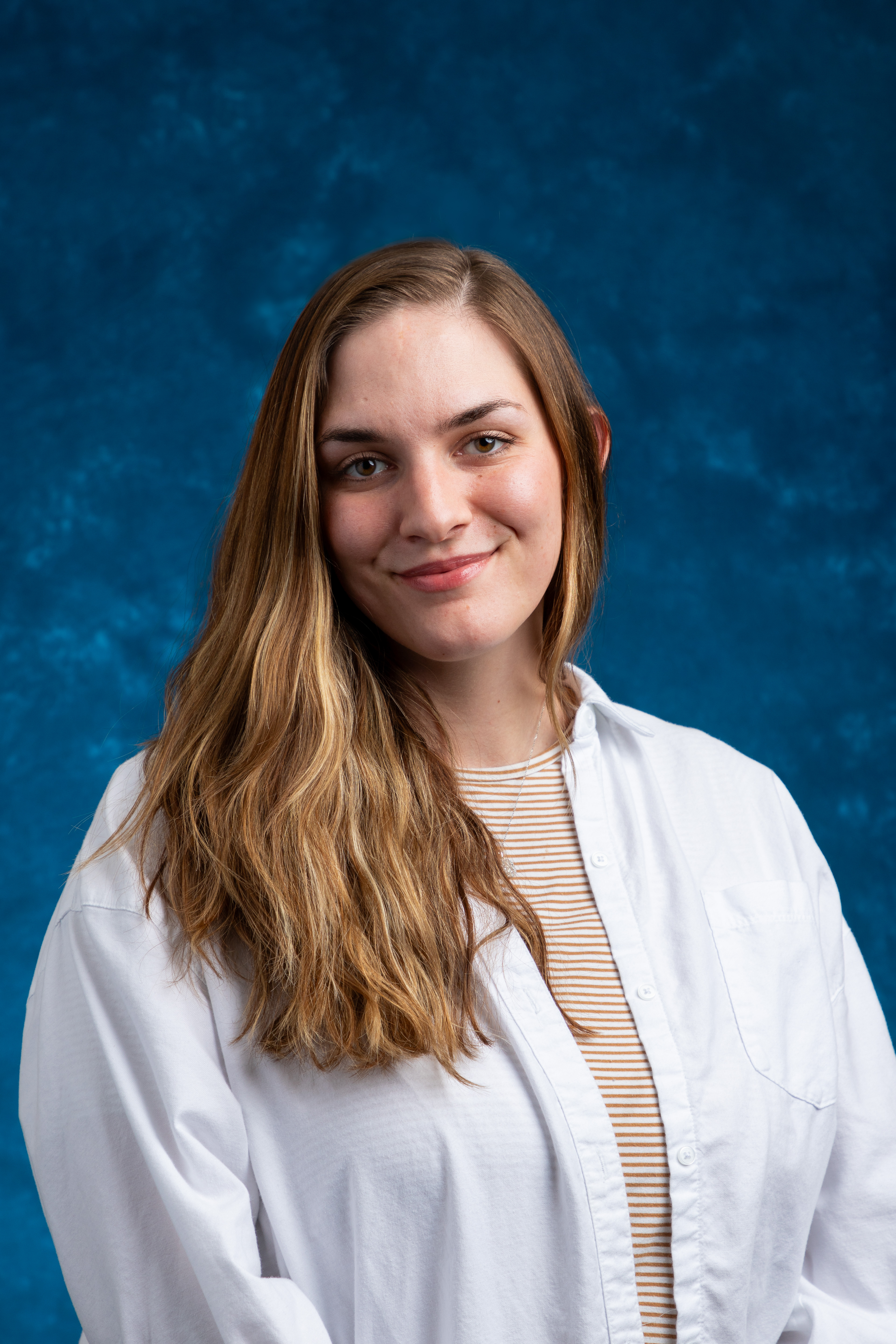 profile image of Tempest Kipp-Evans in front of a blue background