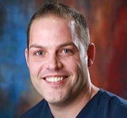 profile image of Kent Arnold in front of a red and blue backdrop