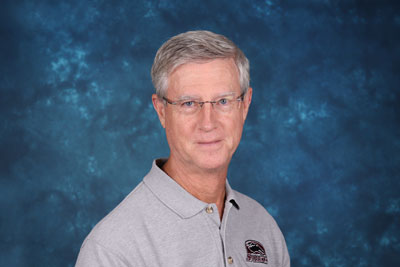 profile image of Paul Bennett in front of a blue background