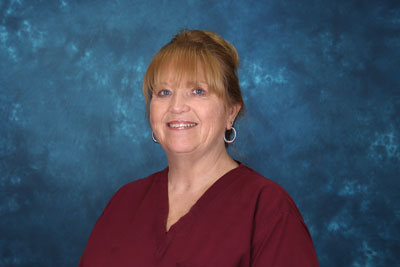 profile image of Julye Martin in front of a blue background