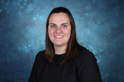 profile image of Sarah Skidmore in front of a blue background