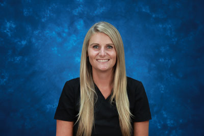 profile image of Ashley Moniger in front of a blue background