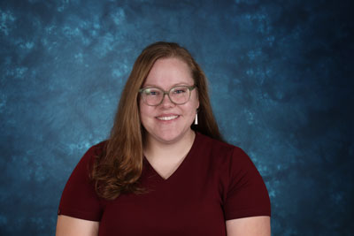 profile image of Rebecca Mattingly in front of a blue background