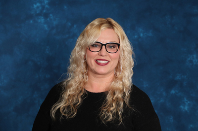 profile image of Tiffany Wilson in front of a blue background