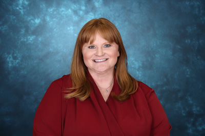 profile image of Shelly Ridgeway in front of a blue background
